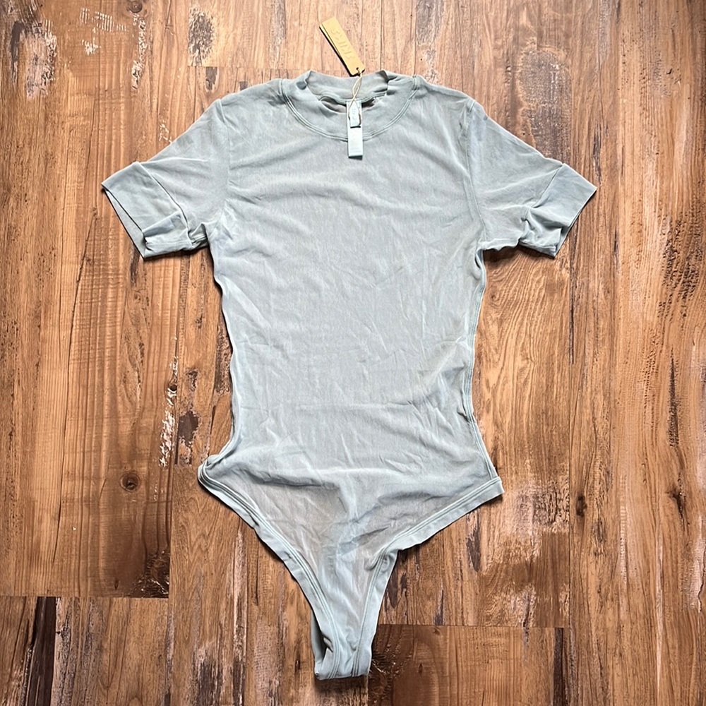 SKIMS Shortsleeved Sheer Thong Bodysuit in Sky Blue